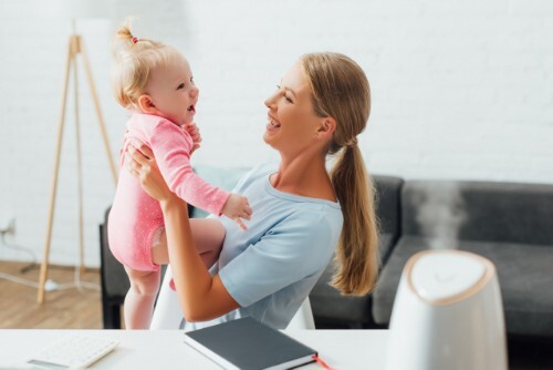 Woman and Baby with Humidifier Running