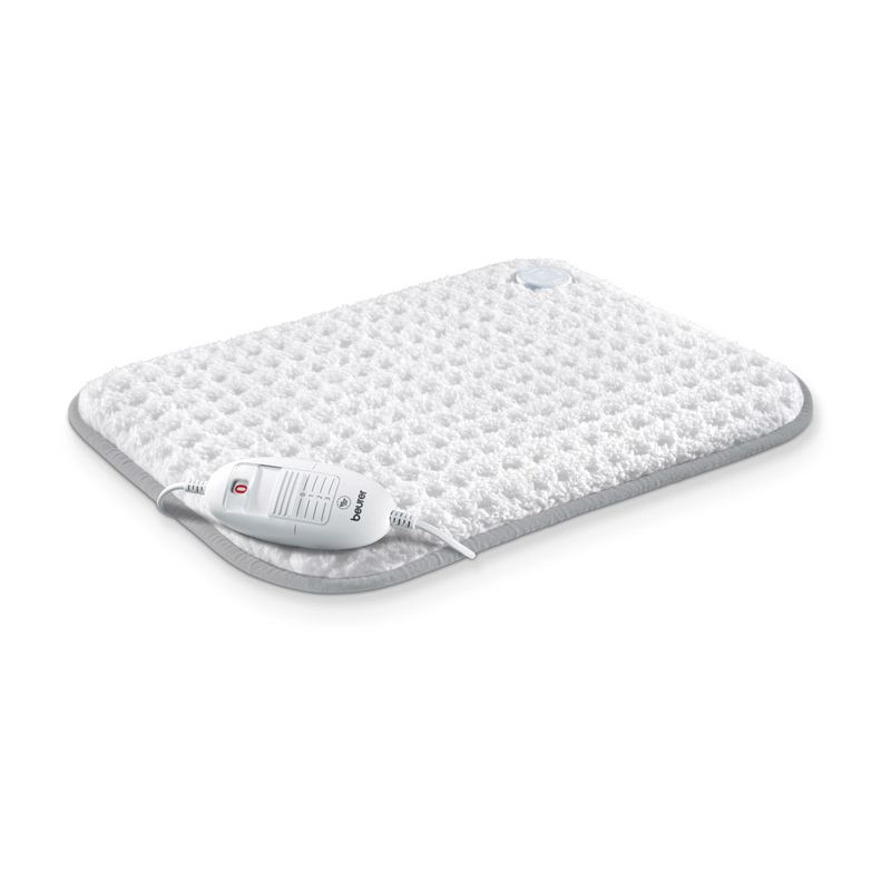 A white heat pad with a wired remote lying on top of it